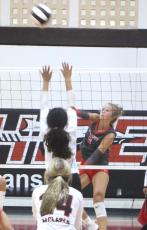 Lafayette setter Havyn Richardson (5) fires a shot over the block of Fort White's Shaylee Lindsey during the Hornets' 3-1 win over the Indians. (MORGAN MCMULLEN/Lake City Reporter)