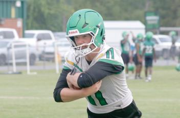 Suwannee quarterback Haigen Johnson runs through a drill during the first day of fall practice on July 27. (JAMIE WACHTER/Lake City Reporter)