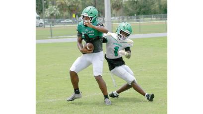 Suwannee safety Josh Johnson intercepts a pass in front of receiver Jamarcus Cherry during practice on Aug. 3. (JAMIE WACHTER/Lake City Reporter)