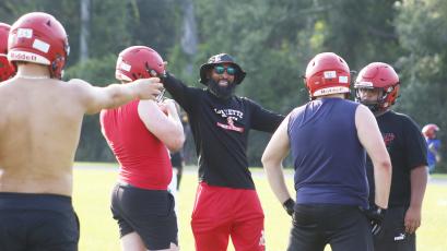 Lafayette coach Marcus Edwards directs his players during practice on July 28. (JAMIE WACHTER/Lake City Reporter)
