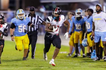 Fort White linebacker Brandon Robinson returns a fumble for a touchdown against Chiefland on Aug. 28. (JACK HOWDESHELL/Lake City Reporter)