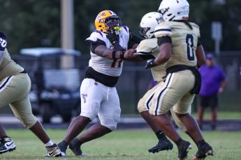 Defensive tackle Jaden McCray tries to fight off an Oakleaf block during Columbia's Kickoff Classic on August. 14. (GARY LLOYD MCCULLOUGH/Special to the Reporter)