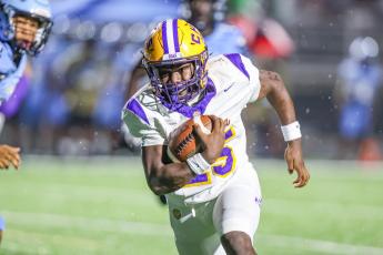Columbia running back Jerome Horne turns the corner of the Ribault defense for a gain last Friday. (GARY LLOYD MCCULLOUGH/Special to the Reporter)