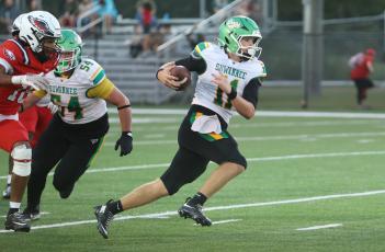 Suwannee quarterback Haigen Johnson scrambles upfield against Wakulla last Friday. (PAUL BUCHANAN/Lake City Reporter)