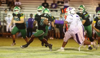 Suwannee running back Travon Fead tries to escape a tackle from a Gainesville defender last Friday. (PAUL BUCHANAN/Lake City Reporter)