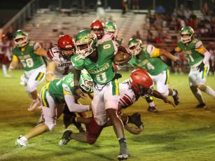 PAUL BUCHANAN/Lake City Reporter Suwannee running back Travon Fead gets around the corner of the Lafayette defense last Friday. (PAUL BUCHANAN/Lake City Reporter)