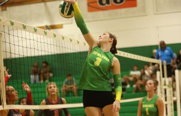 Suwannee hitter Jaylin Nash gets a shot over the net against Lafayette on Tuesday. (PAUL BUCHANAN/Lake City Reporter)