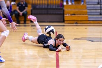 Columbia libero Kinslee Hall hits the floor hard as she dives for a dig against Lafayette on Sept. 3. (JACK HOWDESHELL/Lake City Reporter)