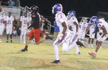 Fort White running back Ezekiel Powell sprints to the end zone for an 83-yard touchdown run and the winning score in Friday’s 27-20 win over Taylor County. (MORGAN MCMULLEN/Lake City Reporter)