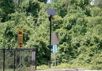FILE A Flock Safety license plate reader camera sits along Baya Avenue by the entrance to the Lake Montgomery boat ramp. The state is shutting down the use of the cameras on state roads due to privacy concerns. (FILE)