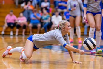 Branford setter Addison Barnes tries to keep the ball in play against Lafayette on Oct. 6. (JACK HOWDESHELL/Lake City Reporter)