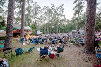 A crowd watches a performance on the main stage at a previous Florida Folk Festival at the Stephen Foster Folk Culture Center State Park in White Springs. Next year’s event is being moved to April. (COURTESY)
