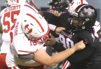 Fort White defensive tackle Jaden McCray fights off Hamilton County center Cash Roberson as he blows up a run play last Friday. (MORGAN MCMULLEN/Lake City Reporter)