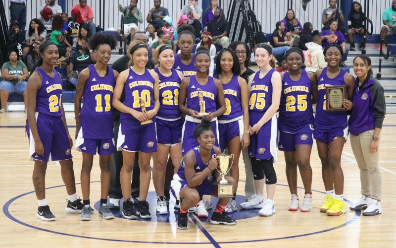 Columbia’s girls basketball team is pictured with the trophy after winning the Hitchcock’s Challenge on Monday. (JORDAN KROEGER/Lake City Reporter)