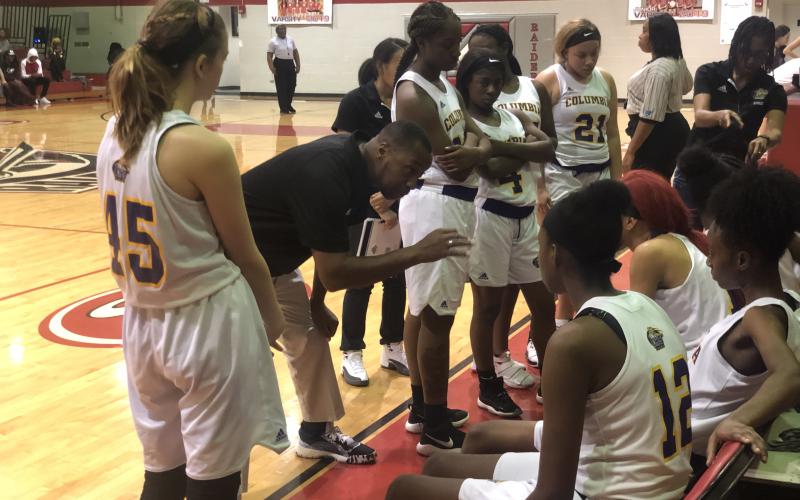 Columbia coach Anthony Perry coaches up his team during a timeout during Friday’s game against Oak Hall in the Hitchcock’s Challenge. (ZACH ABOLVERDI/Lake City Reporter)