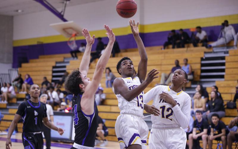 Columbia guard Tray Tolliver puts up a shot in traffic against Saint Francis Catholic on Tuesday night. (BRENT KUYKENDALL/Lake City Reporter)
