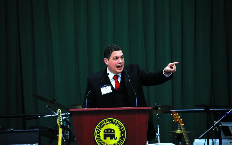 Columbia County GOP chairman Hunter Peeler fires up the crowd before Huckabee takes the stage. (CAMERON VINING/Special to the Reporter)