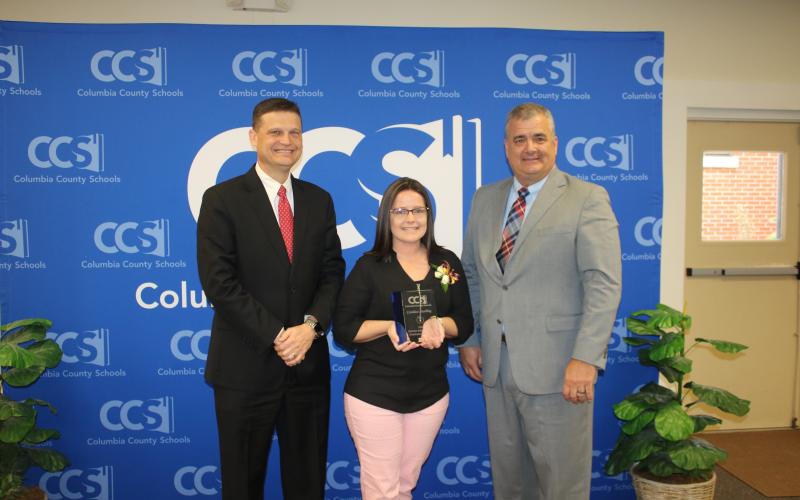 Steve Nelson (from left), Columbia School Board chairman poses with Candace Starling and Lex Carswell, Columbia Schools’ Superintendent after Starling, a CHS secretary, was named the 2020 School-Related Employee of the Year Award winner Thursday. (TONY BRITT/Lake City Reporter)