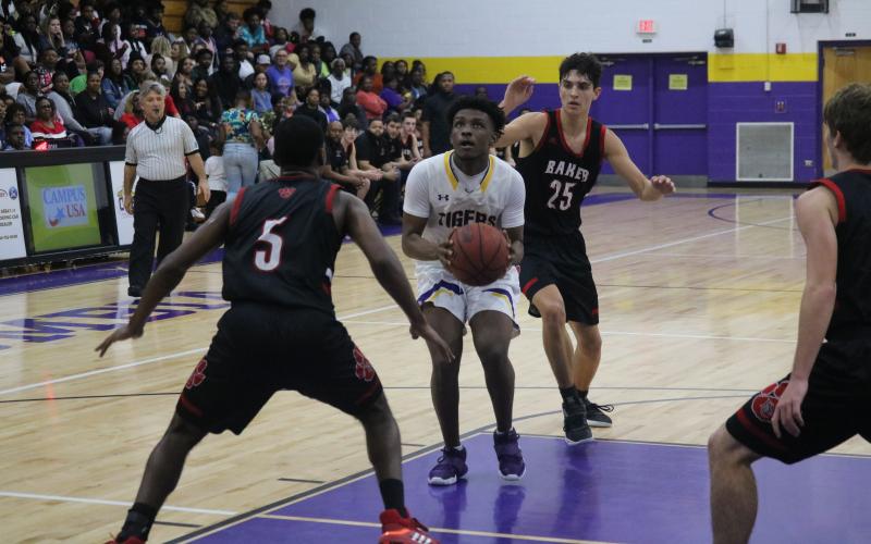 Columbia guard Darrien Jones drives into the lane to take a shot against Baker County on Friday night. (JORDAN KROEGER/Lake City Reporter)