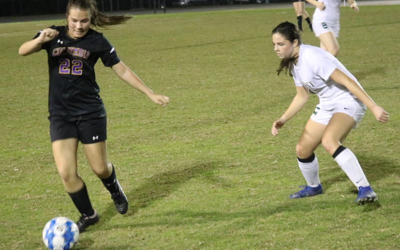 Columbia’s Hannah Dicks moves the ball up the field against Forest on Friday night. (JORDAN KROEGER/Lake City Reporter)