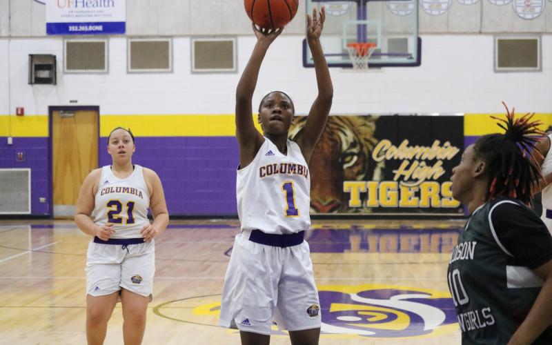 Columbia guard Anzarria Jerkins pulls up for a jumper against Madison County on Tuesday night. (ZACH ABOLVERDI/Lake City Reporter)
