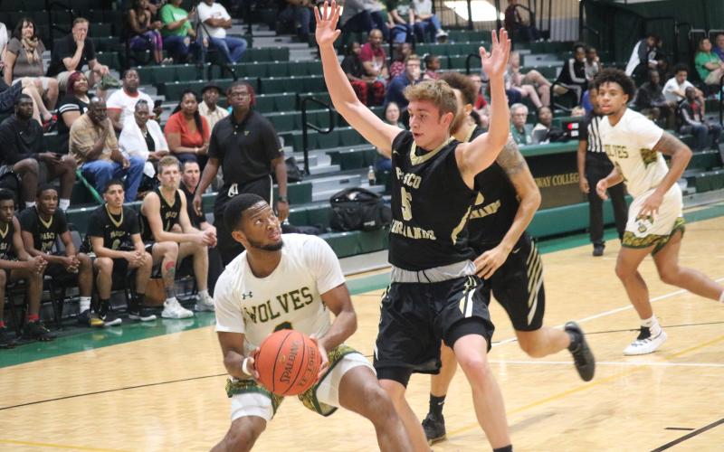 FGC guard Kenny Brown looks for a shot as Pasco-Hernando guard Hayden Greene defends on Saturday. (JORDAN KROEGER/Lake City Reporter)