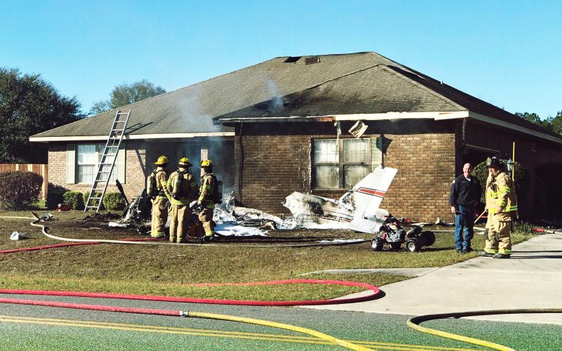 First responders are pictured at the scene of a plane crash at Cannon Creek Airpark Saturday morning. (ROBERT BRIDGES/Lake City Reporter)