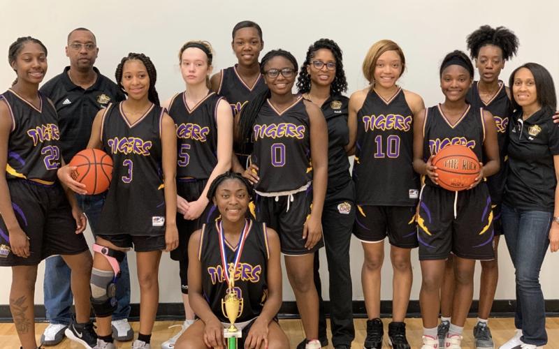 Columbia's girls basketball team with the third-place trophy at the B-Town Classic in South Carolina. (COURTESY)