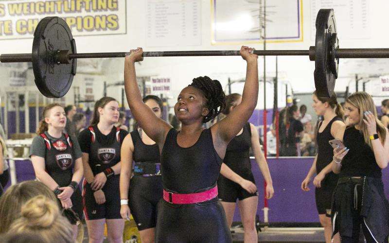 Columbia weightlifter Miracle Rentz-Black finishes her clean and jerk during Thursday’s meet against Santa Fe. (JEN CHASTEEN/Special to the Reporter)