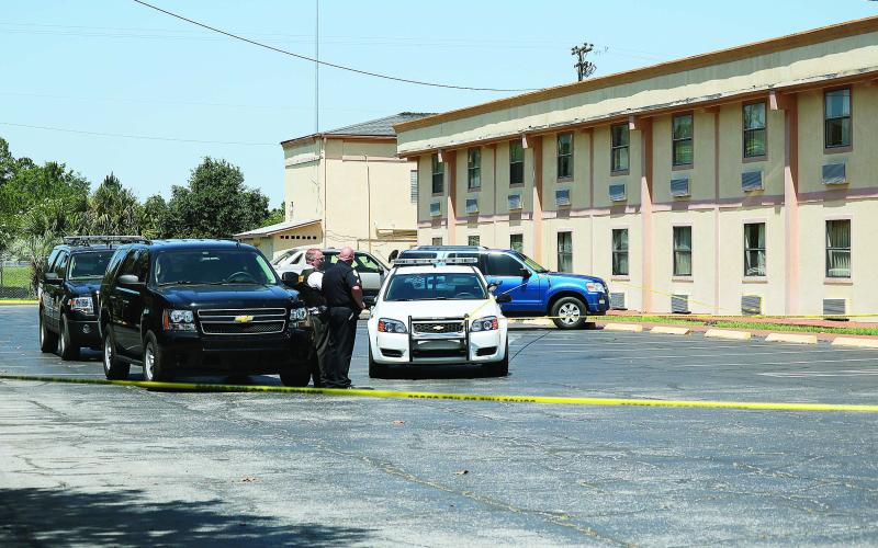 Officers at the scene of a homicide at the Ramada Limited motel on U.S. 90 in 2016. (FILE)