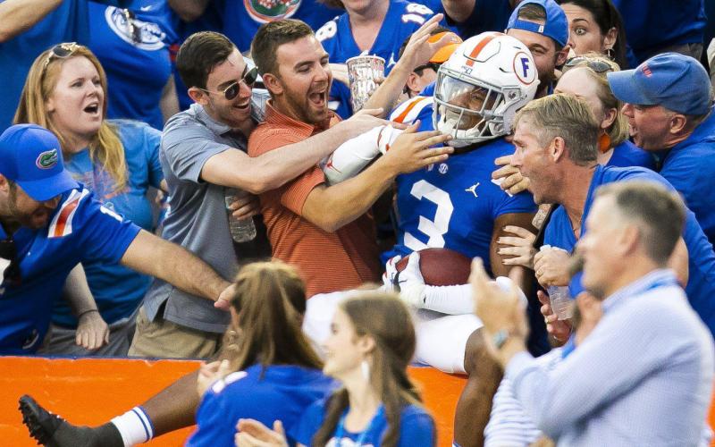 Florida defensive back Marco Wilson (3) celebrates an interception against Auburn in October. Wilson is returning to the Gators for 2020. (TRIBUNE NEWS SERVICE)