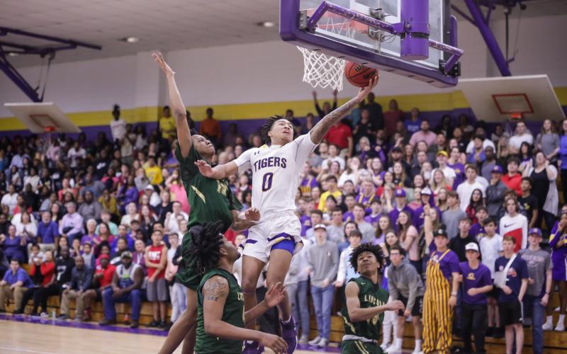 Columbia guard Jordan Smith scores a layup after a steal against Lincoln during Tuesday night's Region 1-6A semifinal. (BRENT KUYKENDALL/Lake City Reporter)