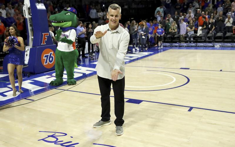 Former University of Florida head coach and Gator legend Billy Donovan does the Gator Chomp as the court is renamed Billy Donovan Court during Saturday’s game against Vanderbilt. (AP PHOTO)