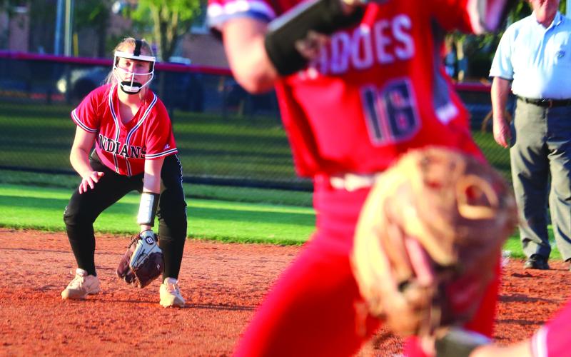 Hailey Clemons gets in her stance playing first base for Fort White during last season’s district tournament against Bradford. (FILE)