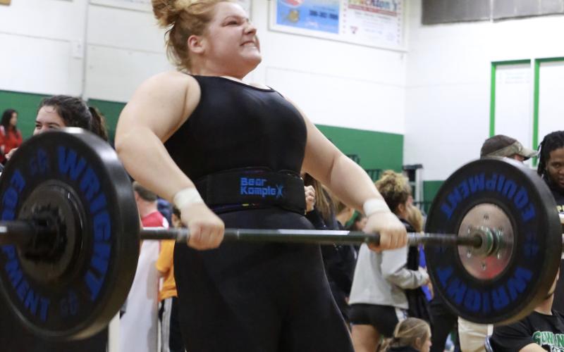 Columbia weightlifter Reece Chasteen lifts the bar during her clean and jerk at the Region 1-2A Meet on Saturday. (JEN CHASTEEN/Special to the Reporter)