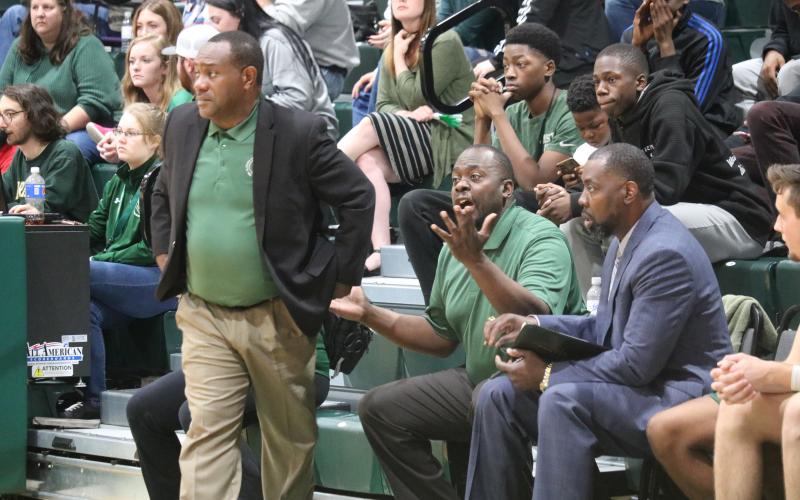 FGC assistant coach C.C. Wilson calls out to his players as head coach Charles Ruise looks on during Saturday's Division II Region 8 championship against Pasco-Hernando State College. (JORDAN KROEGER/Lake City Reporter)
