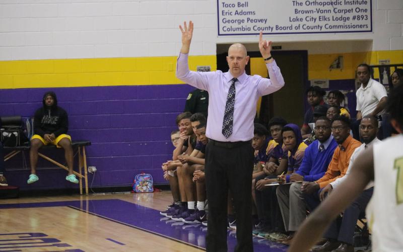Columbia coach Steve Faulkner calls out a play to his team during Saturday night's game against Lincoln. (JORDAN KROEGER/Lake City Reporter)