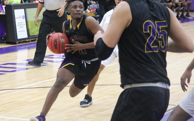 Columbia guard Darrien Jones drives to the basket against Lincoln in the District 2-6A championship on Feb. 15. (JORDAN KROEGER/Lake City Reporter)