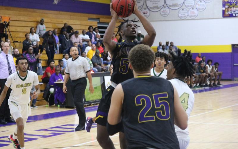 Columbia guard Darrien Jones pulls up for a shot against Lincoln Saturday night.  (JORDAN KROEGER/Lake City Reporter)