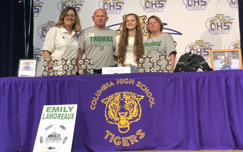 Columbia goalkeeper Emily Lamoreaux signed her national letter of intent to play at Thomas University on Wednesday. Pictured are Thomas coach Julie Orlowski (from left), Lamoreaux's father Terry, Lamoreaux, and Lamoreaux's mother Gina. (JORDAN KROEGER/Lake City Reporter)