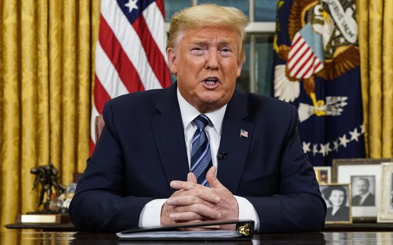 President Donald Trump speaks in an address to the nation from the Oval Office at the White House about the coronavirus Wednesday in Washington. (AP PHOTO)