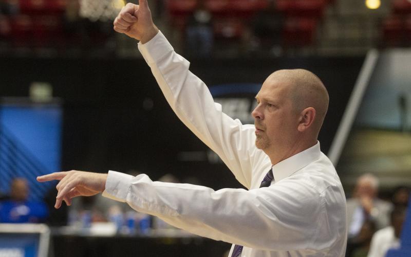 Columbia’s head basketball coach Steve Faulkner instructs his players against Dillard during the Class 6A state semifinals at The RP Funding Center on March 5, in Lakeland. (MICHAEL WILSON/Special to the Reporter)