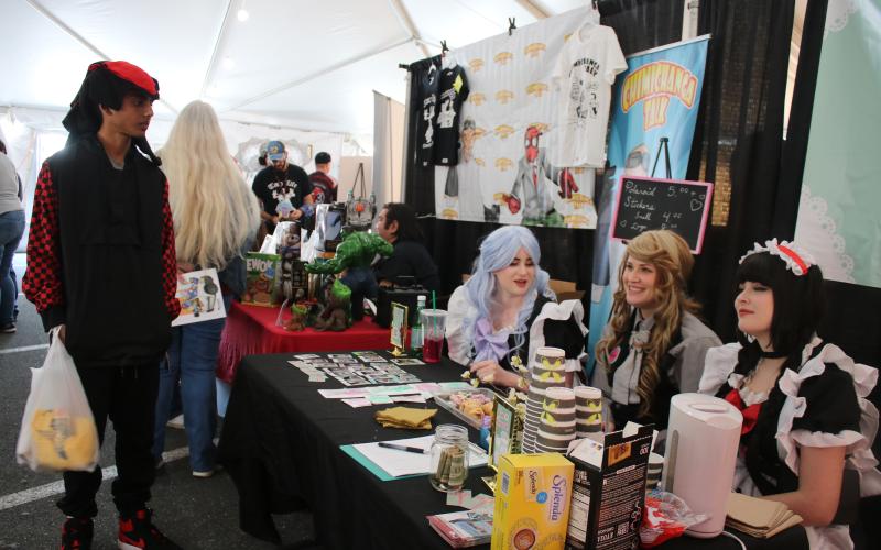 The Idols a la Carte of Tallahassee answer questions about their anime event called Maid Cafe and take photos with convention attendees. (AMY HIETT/Special to the Reporter)