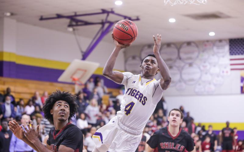 Columbia guard guard Kneney flies toward the basketball to score against Chiles during the Region 1-6A quarterfinals on Feb. 20. (BRENT KUYKENDALL/Lake City Reporter)