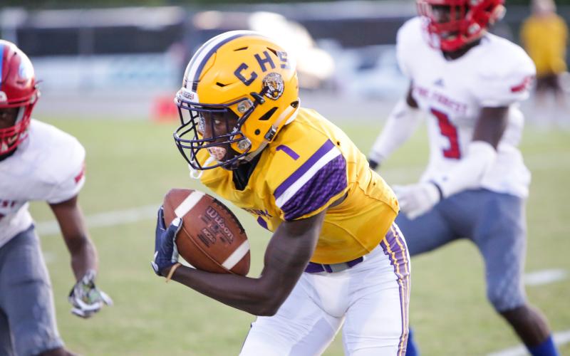 Columbia receiver Jaden Williams runs up the field after a catch against Pine Forest last season. (FILE)