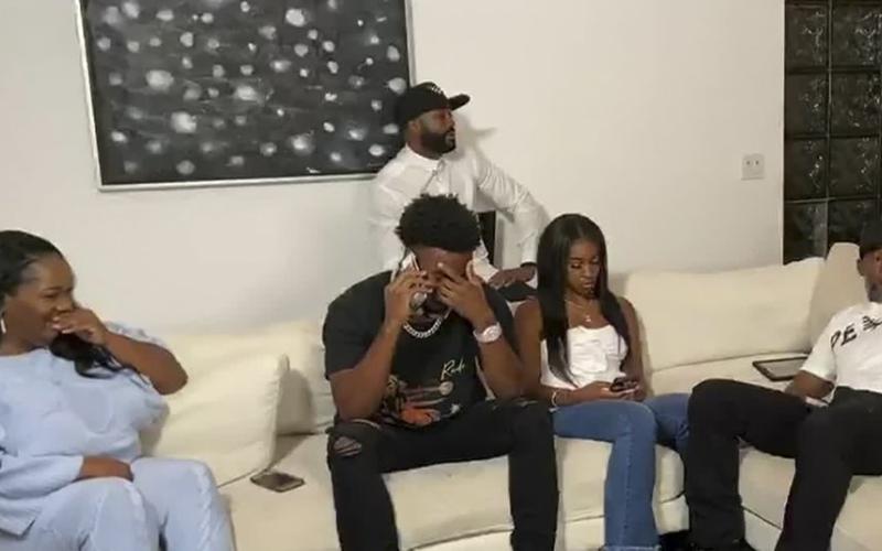 In this still image from video provided by the NFL, CJ Henderson talks on the phone during the NFL draft on Thursday. The Jacksonville Jaguars selected Henderson in the first round of the NFL draft. (NFL)