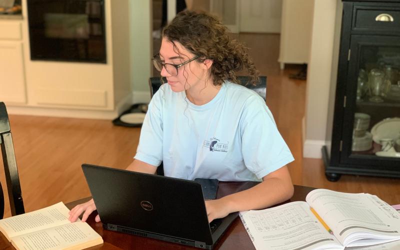 CHS senior Delaney Williams is seen hitting the books at home on Monday. (COURTESY)
