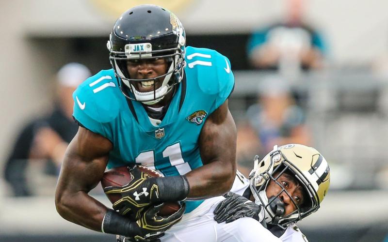 Jacksonville Jaguars wide receiver Marqise Lee (11) catches a pass defended by New Orleans Saints defensive back Patrick Robinson during the first quarter of an NFL preseason football game at TIAA Bank Field on Aug. 9, 2018, in Jacksonville. (TRIBUNE NEWS SERVICE)