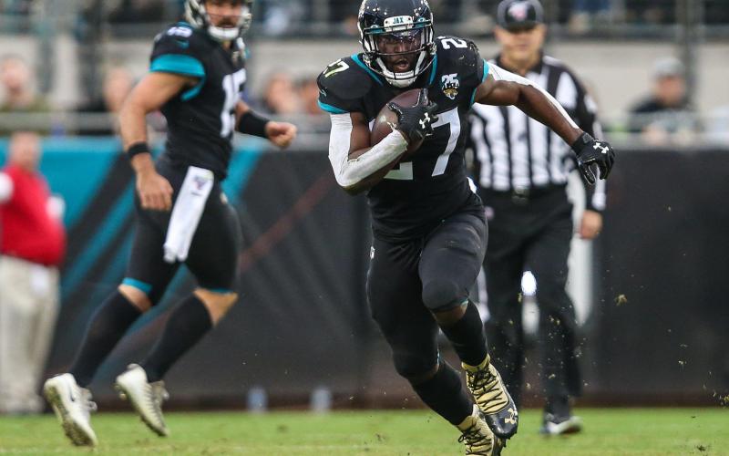 Jacksonville Jaguars running back Leonard Fournette (27) runs for a first down during the first half of an NFL football game against the Los Angeles Chargers at TIAA Bank Field, Sunday, Dec. 8, 2019 in Jacksonville. (TRIBUNE NEWS SERVICE)