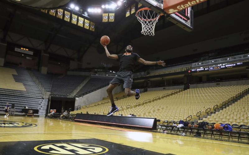 Florida team manager Chris Sutherland is shown warming up before a game between Florida team managers and Missouri team managers, the night before an NCAA college basketball game between Florida and Missouri, at Mizzou Arena in Columbia, Mo. Sutherland waited nearly five years to finally play college basketball. (ALEX DE LA OSA/UAA Communications)